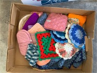 lot of mostly handmade pot holders