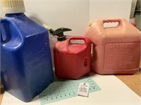 2 Gas Cans And Other Jug