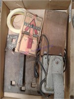 Mouse trap, tape, large spike on metal plate