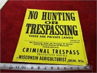 Metal sign. No Hunting/Trespassing Wisconsin.