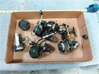 assortment of fishing reels