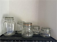 5 clear glass storage jars with locking lids