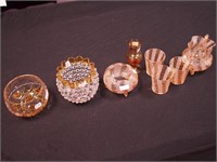 Eight pieces of amber glass, five matching