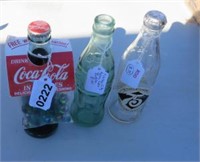 Lot of Coca Cola Bottles with marbles