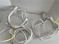 Three (3) white extension cords