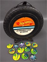 Group DC pinback buttons and a Hot Wheels tire