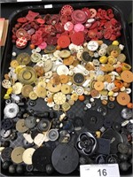 Tray of assorted vintage buttons.