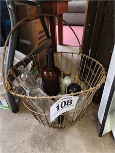 Wire basket w/ vintage bottles