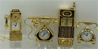 Miniature brass clocks, four different types of