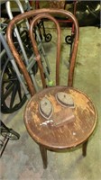 bent wood chair, irons, cowbell