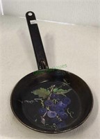 Vintage metal skillet with hand painted grapes.