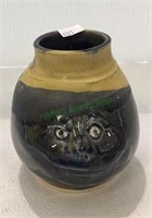 Pottery piece with animal face measuring 5