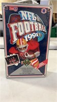 Lot of football cards factory sealed in box.