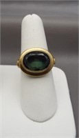 10K Yellow gold ring featuring large green stone.