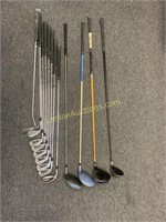 Lot of golf clubs and drivers