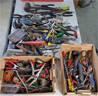 Large assortment of hammers, pliers, masonry