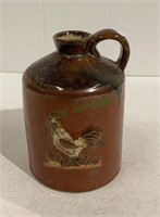 Chicken themed crock jug measuring 6 inches tall.