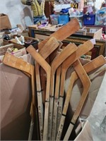 Lot of hockey sticks