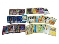80+ modern Pokémon and yu-go-oh! Cards