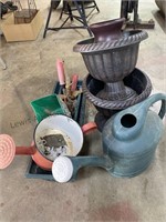 Group of flower pots, watering cans and small