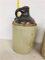 crockery jug with cork stuck in top