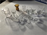 Shot glasses, miniature mugs, amber glass