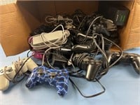BOX OF VIDEO GAME CONTROLLERS & POWER SUPPLIES