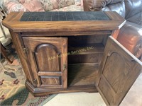 Wood cabinet w/ black tile look on top, 34.5 W X