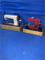 A pair of vintage kids sewing machines