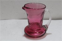 A Small Cranberry Glass Pitcher