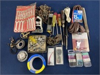 Assorted tools including extension cord, tape,