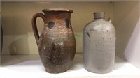 Red clay pottery jug with handle, glazed pottery