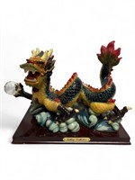 Large colorful Chinese dragon sculpture on water