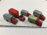 5 tin trucks