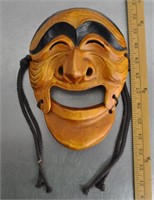 Wood carved face mask wall decor