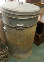 Pair of metal trash cans with lids