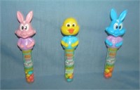 Group of 3 figural nodders / bobble heads candy co