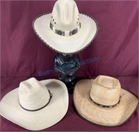 Group of three straw, cowboy hats