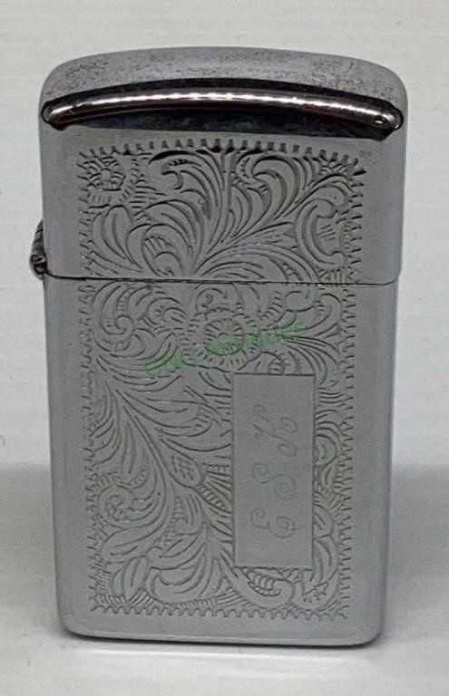 Monograms B. S. K. stainless Zippo lighter.   1