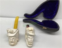 Two very interesting pipes with men’s heads and
