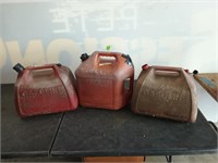 Three 5 gallon gas cans