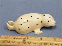 4" ivory carving of a spotted seal, with inset bal