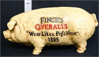 Cast iron Fincks Overalls pig bank