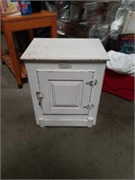 Small white clad cabinet