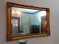 Great vintage mirror in a plastic frame. Approx