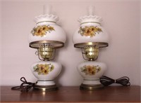 Two vintage floral milk glass hurricane lamps,