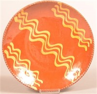 Pennsylvania Yellow Slip-Decorated Redware Plate.