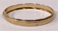 10K gold bracelet, 6g, has clip to open, .5" wide
