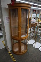 1980's triple curve glass curio cabinet