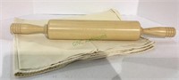 Very nice wooden rolling pin with canvas cloth.